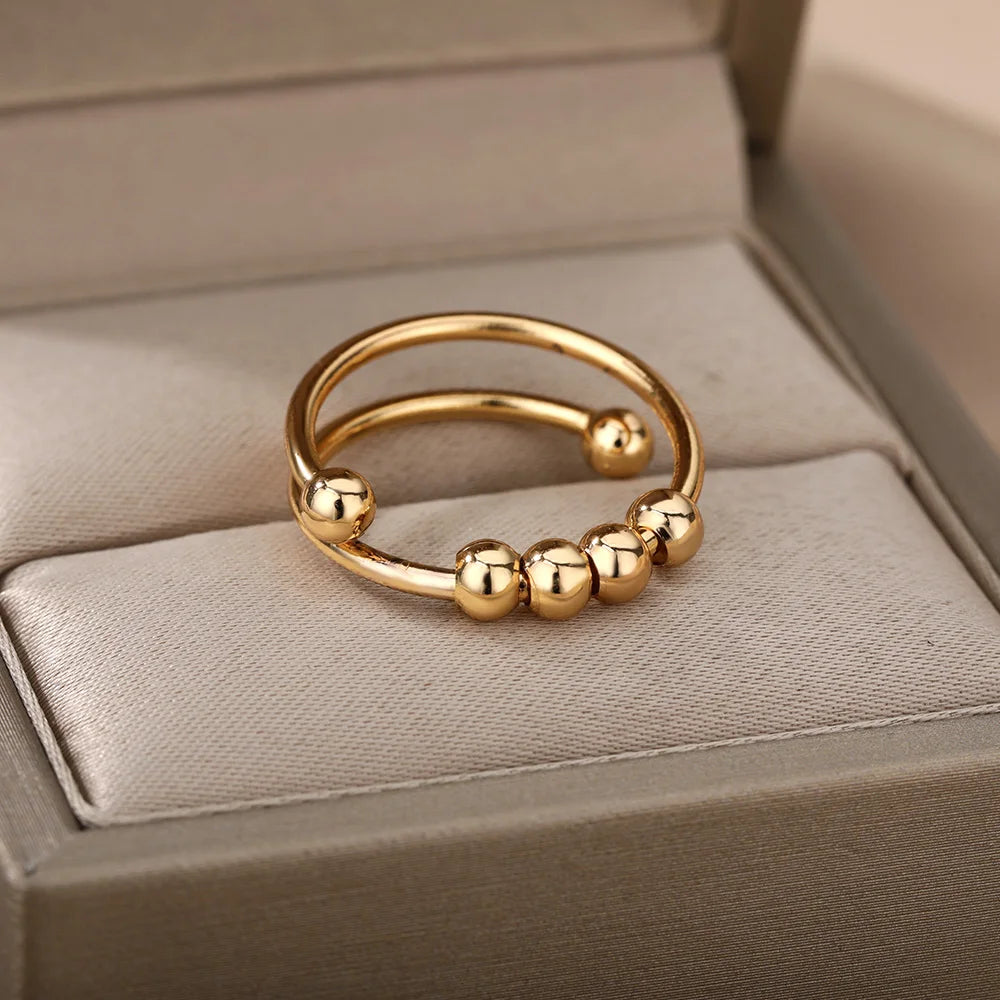 Anillo abierto ajustable de acero inoxidable con cuentas giratorias