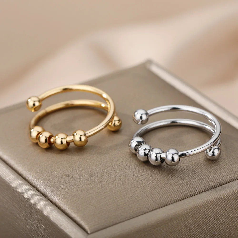 Anillo abierto ajustable de acero inoxidable con cuentas giratorias