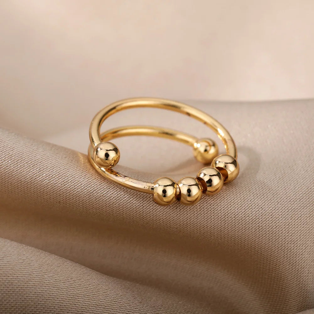 Anillo abierto ajustable de acero inoxidable con cuentas giratorias