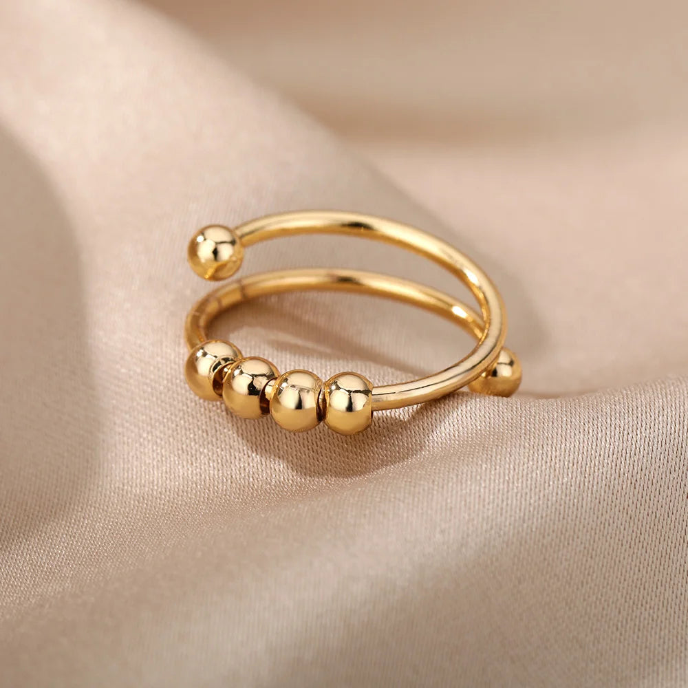 Anillo abierto ajustable de acero inoxidable con cuentas giratorias